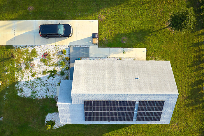 solar panels on the roof of a house. horizontal orientation, blue sky. Energy concept